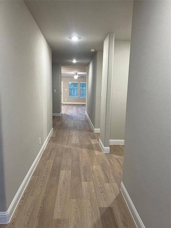 5908 Brittner Drive, Princeton, TX 75071 Hallway featuring recessed lighting, wood-finish flooring, and crisp white trim
