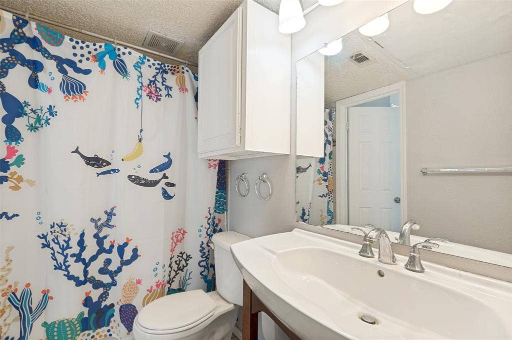 3406 Country Club Drive W, #272, Irving, TX 75038 Vanity with an integrated sink and chrome faucet