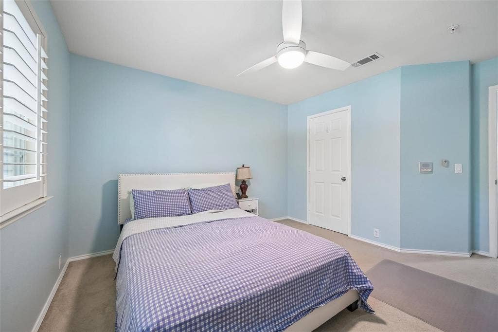 2209 Stonepark Place, McKinney, TX 75071 White plantation shutters, ceiling fan, recessed lighting, and light-colored carpeting