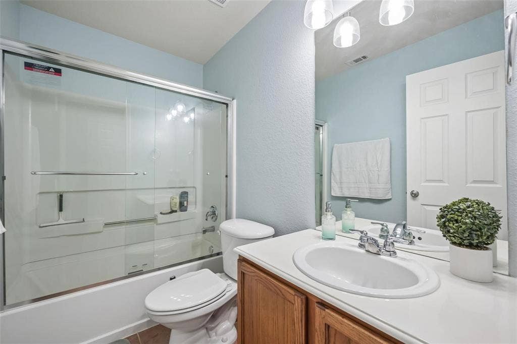 2209 Stonepark Place, McKinney, TX 75071 White countertop vanity with an undermount sink and chrome faucet