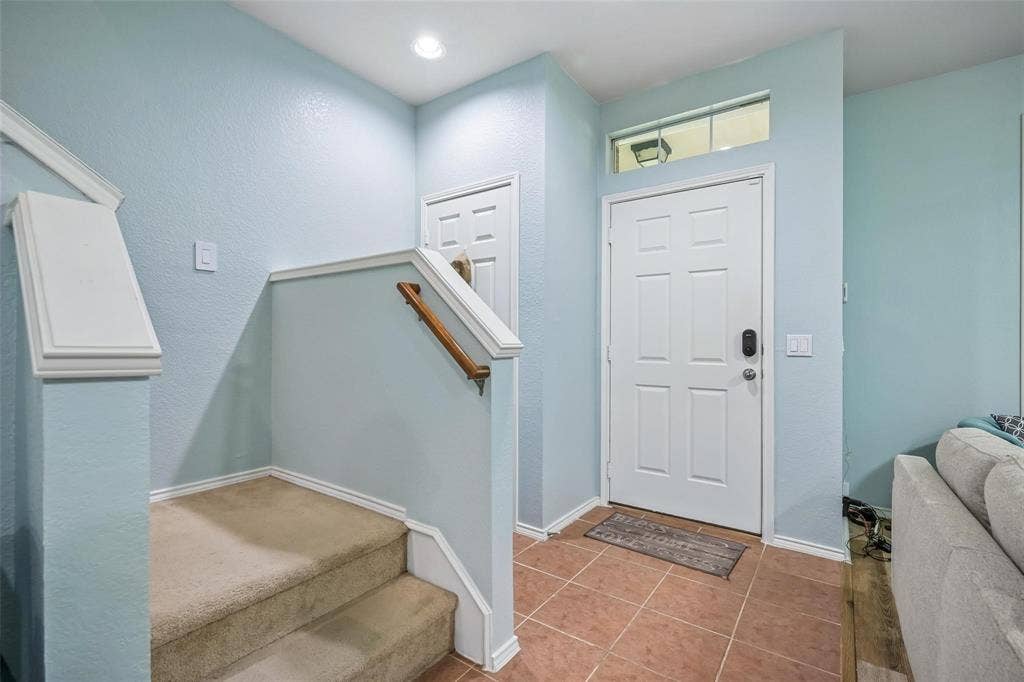2209 Stonepark Place, McKinney, TX 75071 Entryway featuring a paneled door, transom window, recessed lighting, and tile flooring