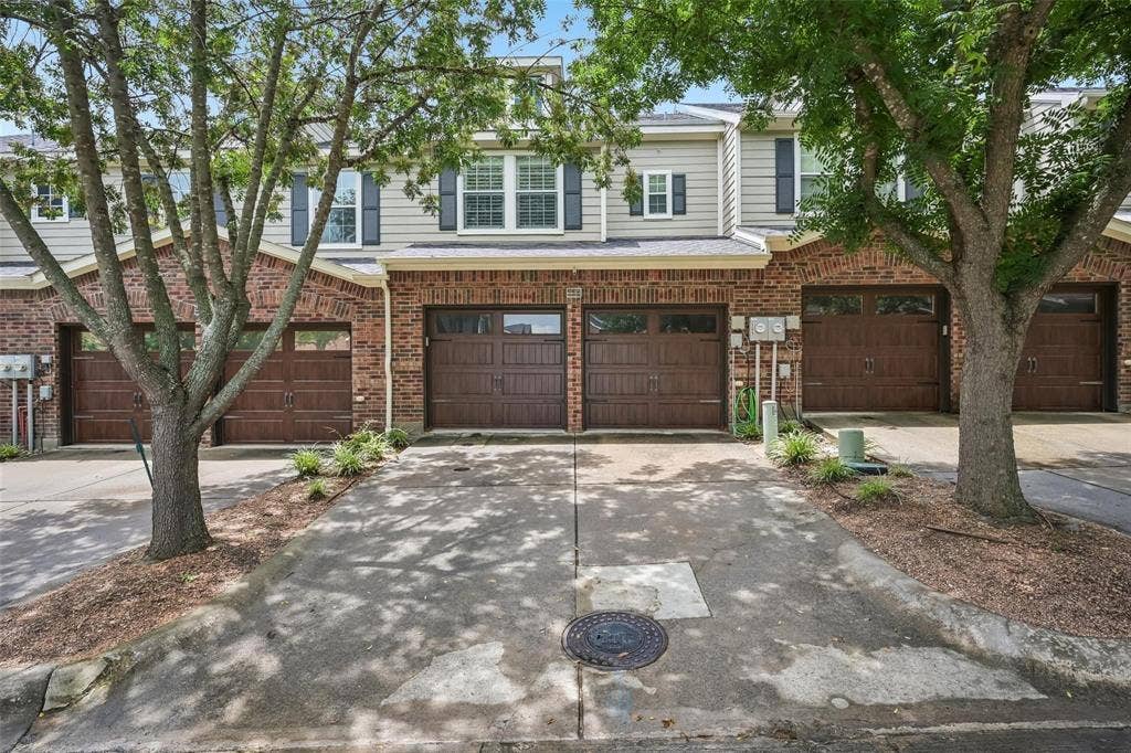 2209 Stonepark Place, McKinney, TX 75071 Brick and siding exterior with individual garages and concrete driveways