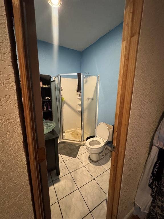 544 Pleasant Meadows Lane, Dallas, TX 75217 Tile flooring, glass-enclosed shower, built-in vanity with vessel sink, and recessed lighting.