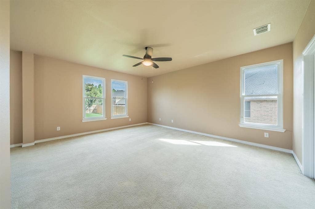 1739 Chadwick Drive, Cedar Hill, TX 75104 Master bedroom with ceiling fan.