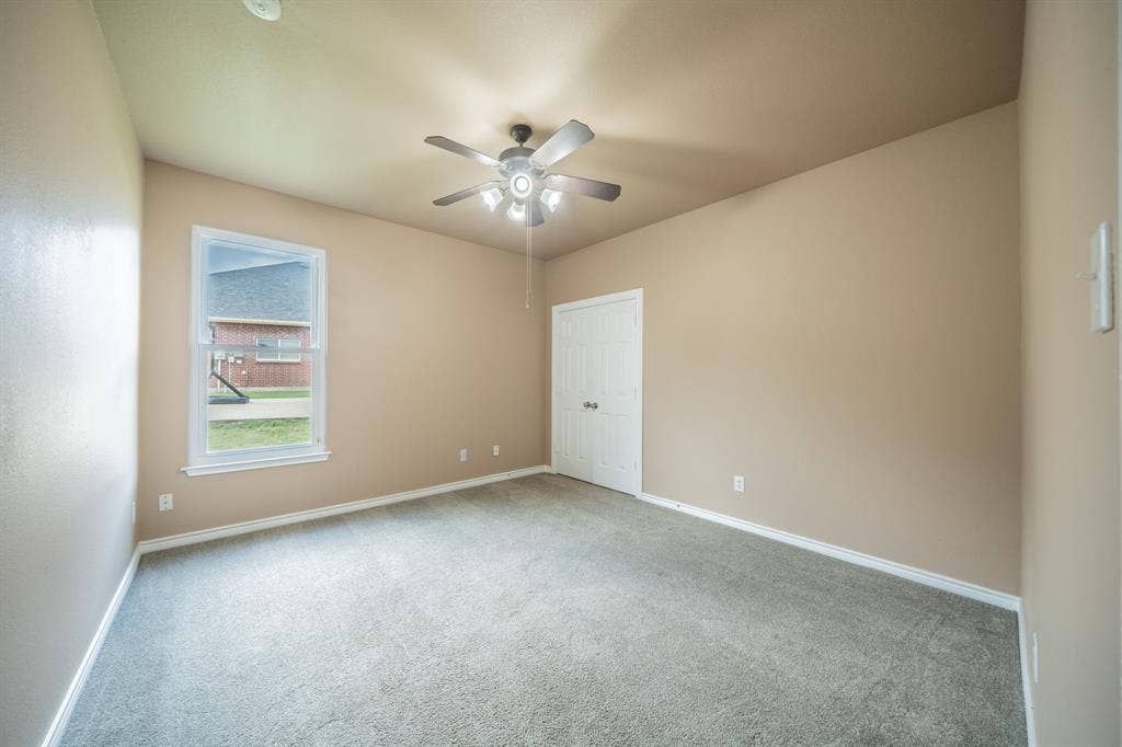 1739 Chadwick Drive, Cedar Hill, TX 75104 First floor fifth bedroom with ceiling fan.