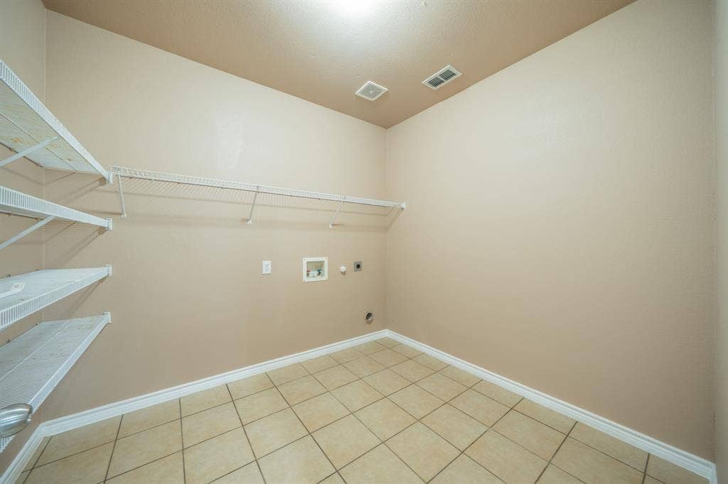 1739 Chadwick Drive, Cedar Hill, TX 75104 Separate utility room with full size washer and dryer electric connections, room for a freezer and shelving for pantry and shelf above W/D for detergent, bleach etc.