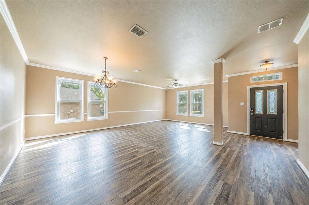 1739 Chadwick Drive, Cedar Hill, TX 75104 Formal dining room with decorative lighting and formal living area with ceiling fan, near the front door entry way.