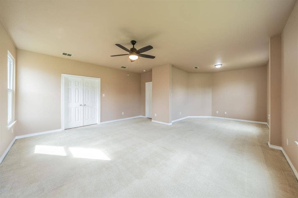 1739 Chadwick Drive, Cedar Hill, TX 75104 Master bedroom looking towards sitting area. This area is 28 feet from wall to wall. Sitting area is 10 feet wide. Bedroom is 15 feet wide.