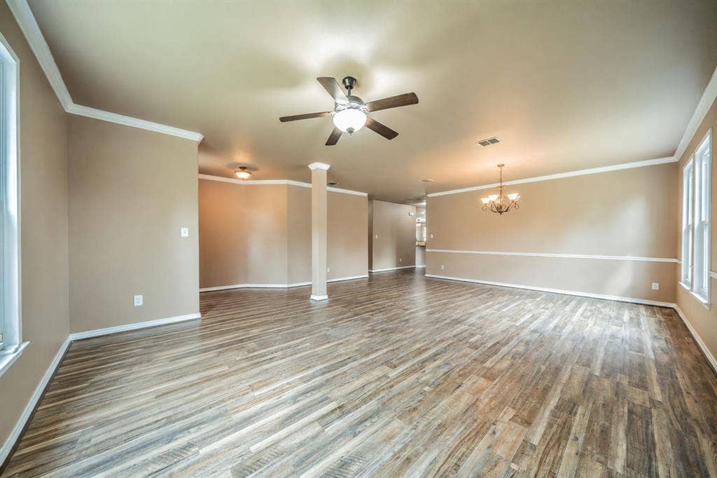 1739 Chadwick Drive, Cedar Hill, TX 75104 Front formal living room with ceiling fan looking toward formal dining room and entry hallway.