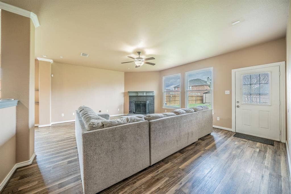 1739 Chadwick Drive, Cedar Hill, TX 75104 Family Room with fireplace, hearth and ceiling fan.