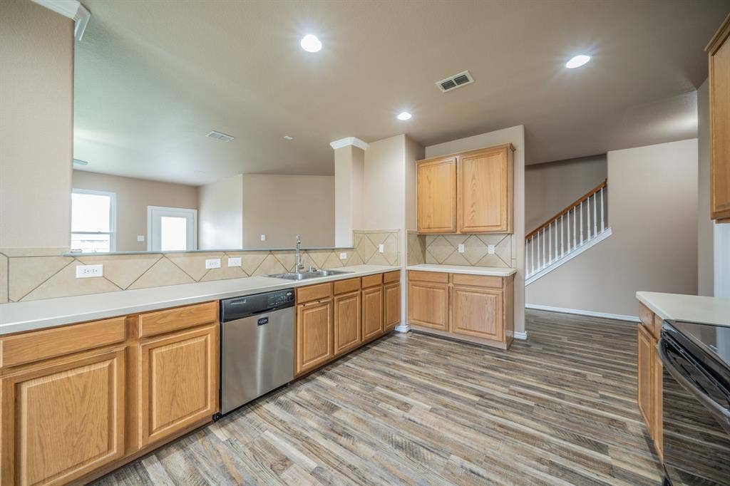 1739 Chadwick Drive, Cedar Hill, TX 75104 Kitchen with dishwasher and tile back splash.