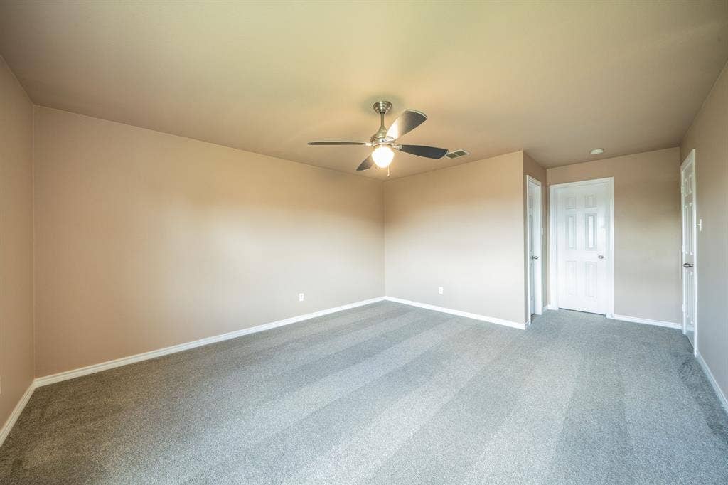 1739 Chadwick Drive, Cedar Hill, TX 75104 Upstairs bedroom with ceiling fan.