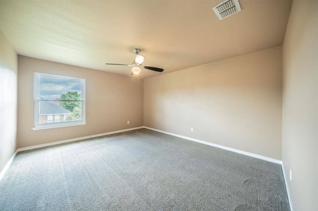 1739 Chadwick Drive, Cedar Hill, TX 75104 First upstairs bedroom with ceiling fan.