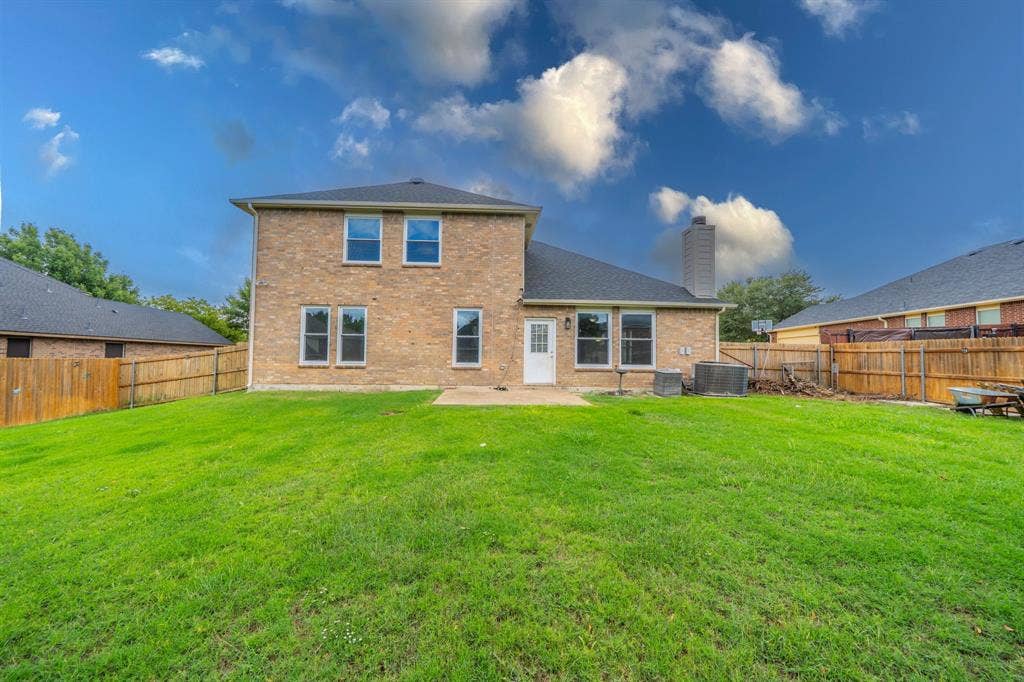 1739 Chadwick Drive, Cedar Hill, TX 75104 View of the back of the house and yard.