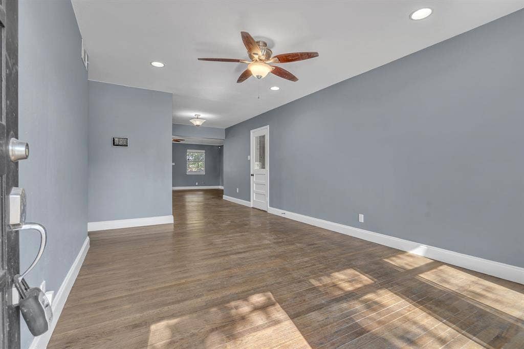Wood-finish flooring, recessed lighting, and a ceiling fan