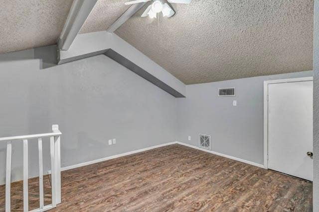 2503 Shady Ridge Drive, Bedford, TX 76021 Vaulted ceiling with exposed beam, wood-finish flooring, and white railing