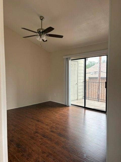 5335 BENT TREE FOREST Drive, #288, Dallas, TX 75248 Wood-finish flooring, vaulted ceiling, ceiling fan with integrated lighting, and a sliding glass door providing access to an exterior balcony