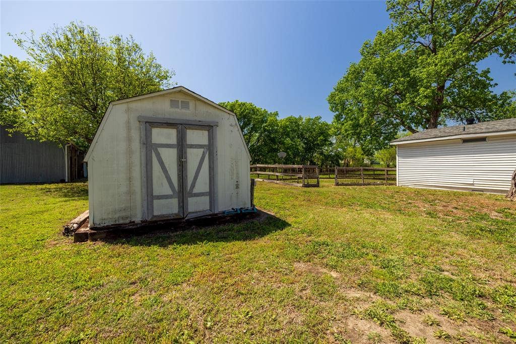 Detached storage shed with double-door entry.