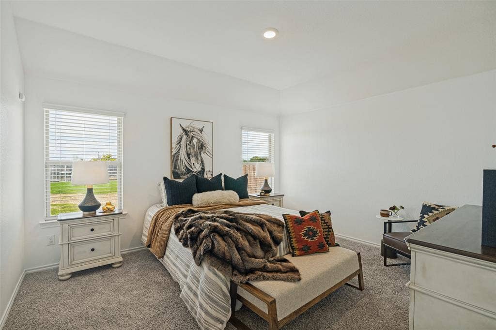 1506 Buckaroo Lane, Josephine, TX 75189 High-ceilinged room featuring neutral wall paint, plush carpeting, and dual windows with horizontal blinds
