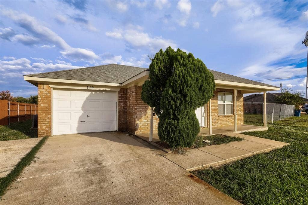 112 Sebastian Lane, Josephine, TX 75173 Single-story brick exterior featuring a hip roof, covered front porch, concrete driveway, and a one-car garage