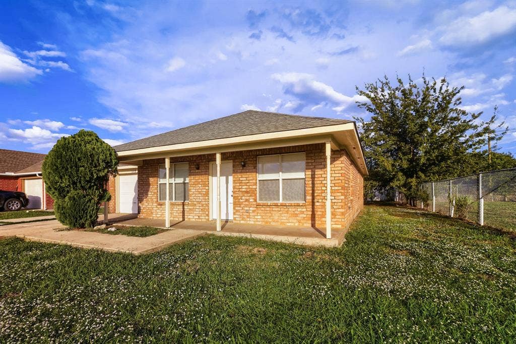 112 Sebastian Lane, Josephine, TX 75173 Single-story brick exterior featuring a covered front porch, asphalt shingle roof, and an attached garage