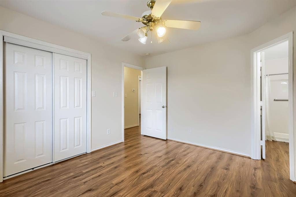 112 Sebastian Lane, Josephine, TX 75173 Room featuring wood-finish flooring, a ceiling fan with integrated lighting, and a sliding-door closet