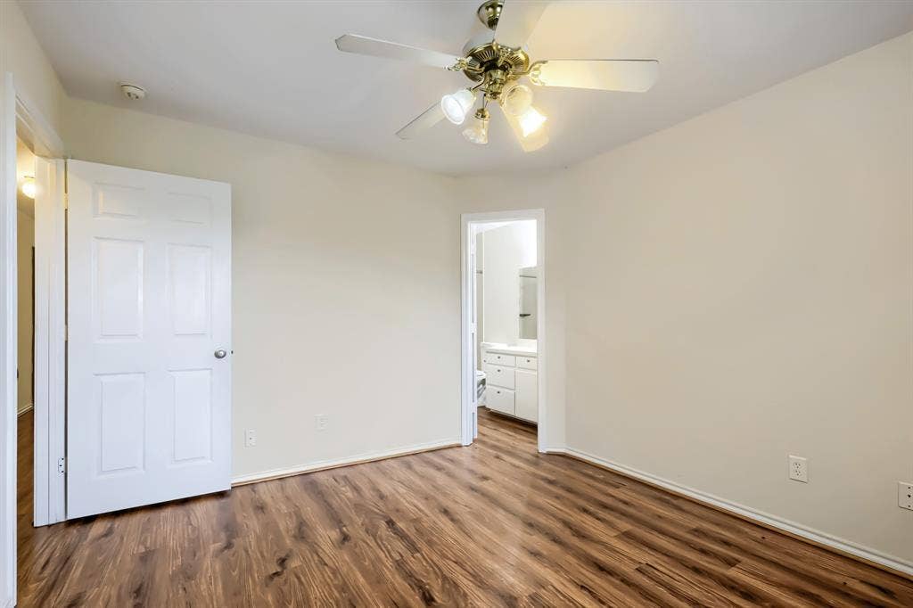 112 Sebastian Lane, Josephine, TX 75173 Room featuring wood-finish flooring, a ceiling fan with integrated lighting, and a six-panel door