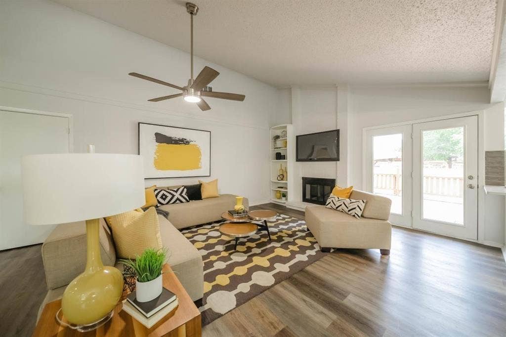 1903 Arvada Drive, Richardson, TX 75081 Vaulted ceilings, wood-finish flooring, built-in shelving, fireplace, and double French doors