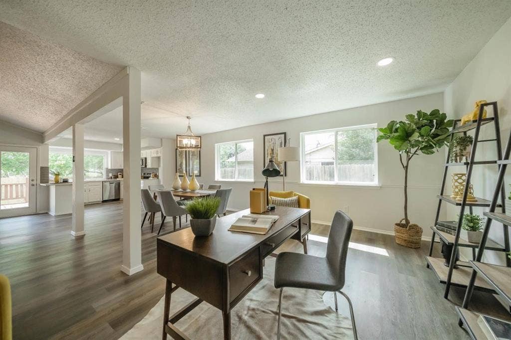 1903 Arvada Drive, Richardson, TX 75081 Open-concept interior featuring wood-finish flooring, recessed lighting, and multiple large windows