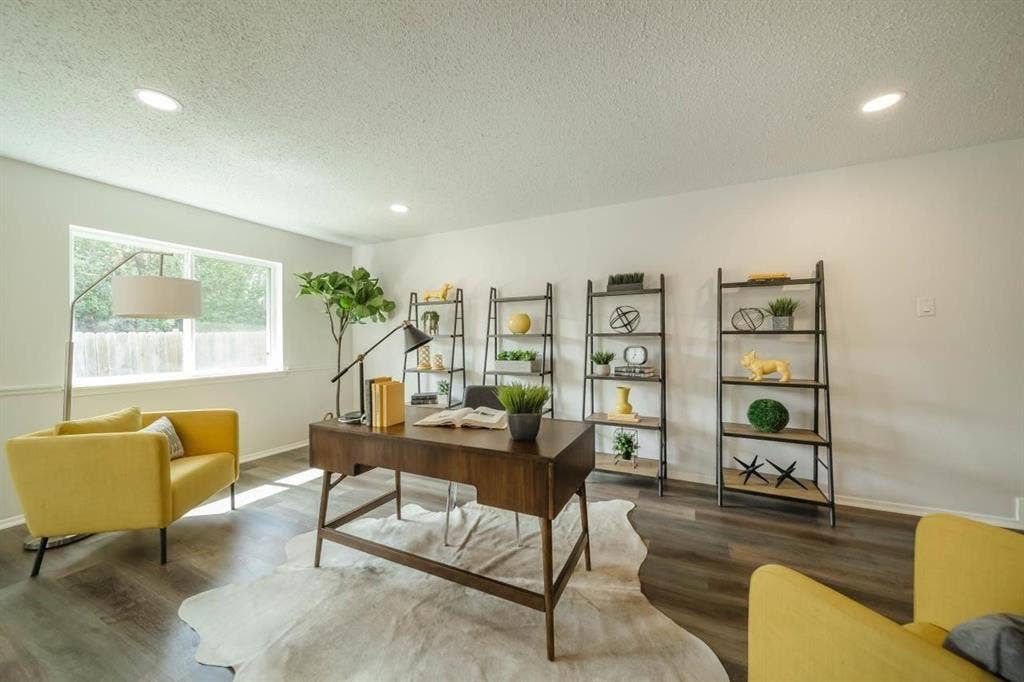 1903 Arvada Drive, Richardson, TX 75081 Room featuring wood-finish flooring, recessed lighting, and a large window with white casing