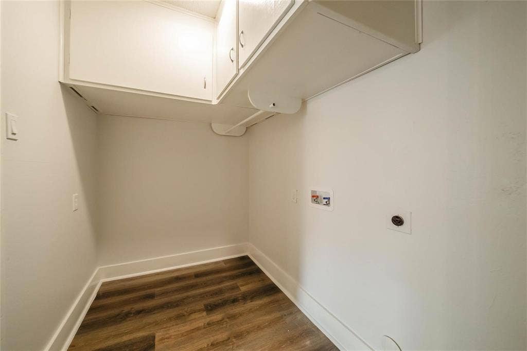 1903 Arvada Drive, Richardson, TX 75081 Utility area featuring wood-finish flooring, ceiling-mounted cabinetry, and dedicated plumbing connections