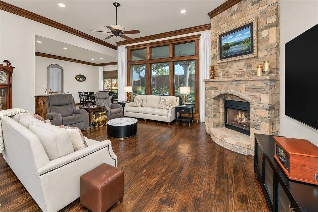 6620 Cedar Grove Drive, North Richland Hills, TX 76182 The great room features a beautiful stone fireplace and gas logs.