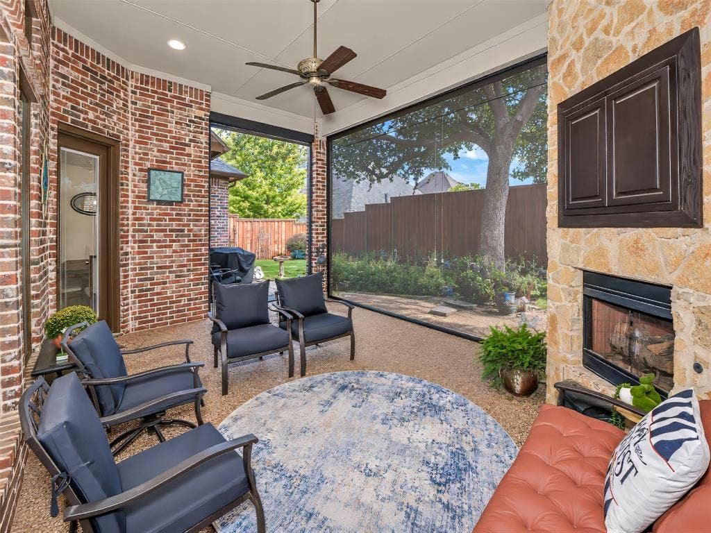 6620 Cedar Grove Drive, North Richland Hills, TX 76182 The covered patio is equipped with remote controlled screening for added comfort during the warm weather.