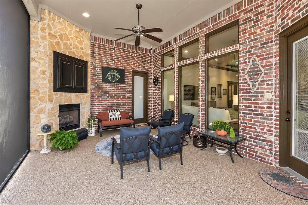 6620 Cedar Grove Drive, North Richland Hills, TX 76182 Enjoy this outdoor covered patio complete with gas log fireplace and space for a television.