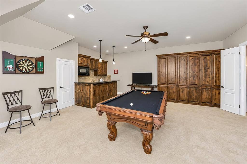6620 Cedar Grove Drive, North Richland Hills, TX 76182 This huge room is equipped with a wet bar and built in cabinets, large enough for a full sized pool table and furniture.