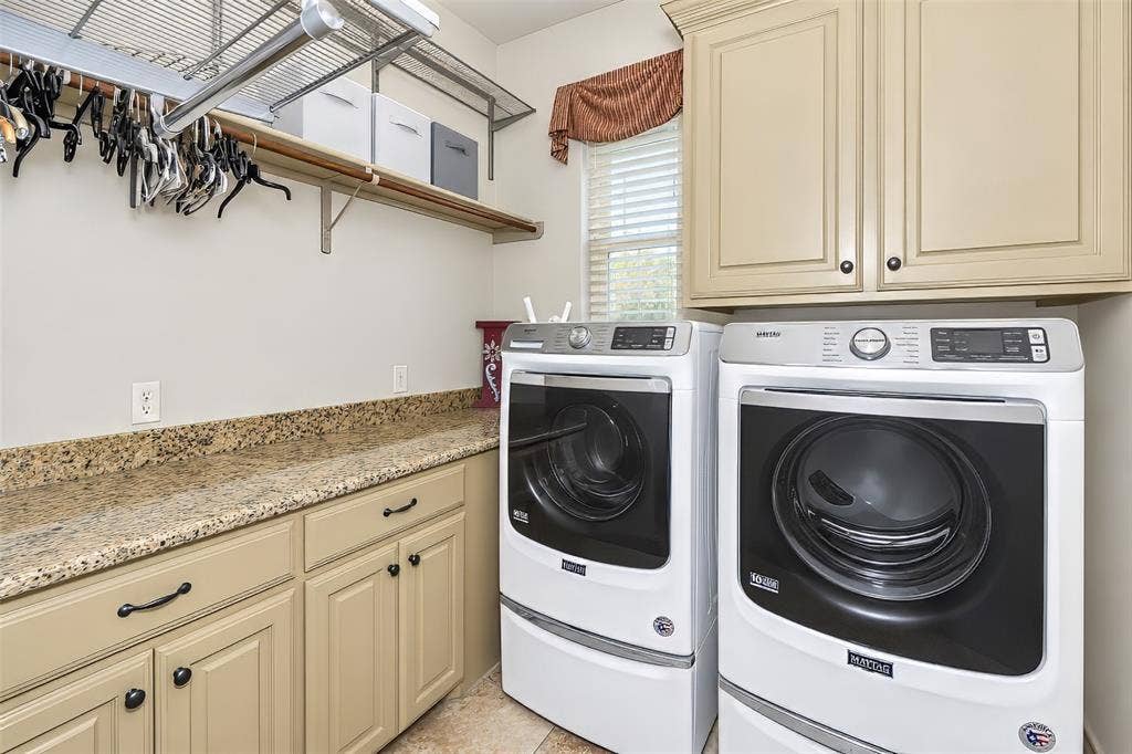 6620 Cedar Grove Drive, North Richland Hills, TX 76182 Large laundry room is large enough for jumbo sized washer and dryer, and features built in cabinetry.