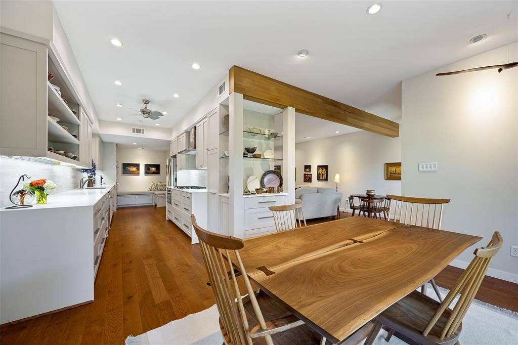 Kitchen featuring white cabinetry, wood-finish flooring, recessed lighting, and a built-in display hutch with glass shelving and drawers