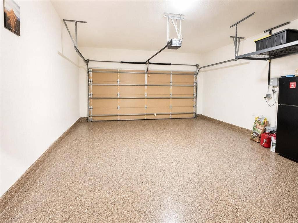 2-car garage features epoxy flooring