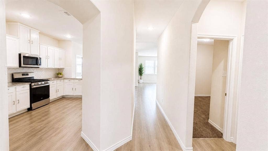 Chef's kitchen open to living for seamless hosting