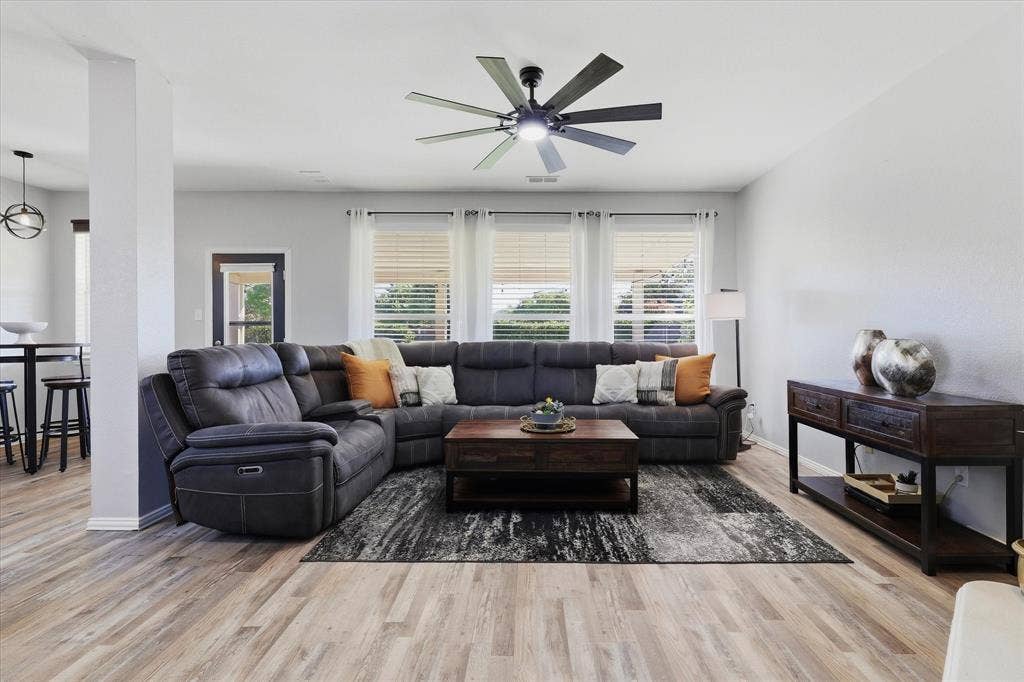 Large backyard-facing windows fill the family room with natural light, creating an inviting space to gather.