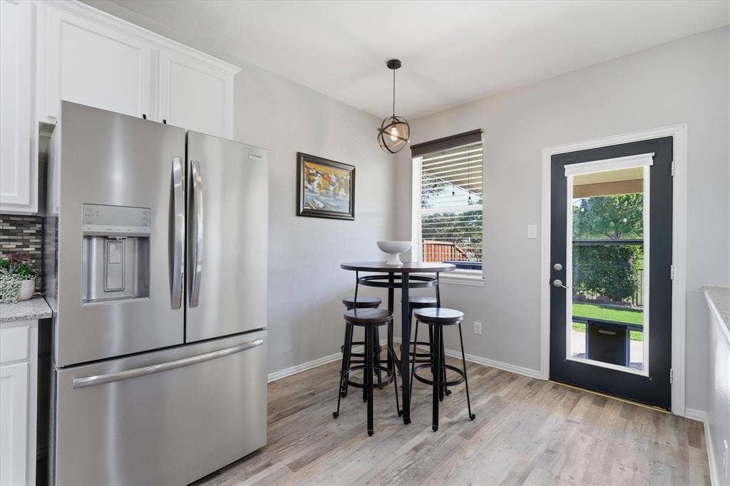 The adjoining breakfast area overlooks the backyard, while the open connection to the family room keeps conversation flowing.
