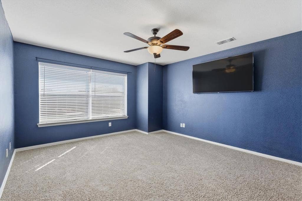 Spacious flex room enclosed by French doors offer versatility for a game room, media room, home office or additional bedroom.