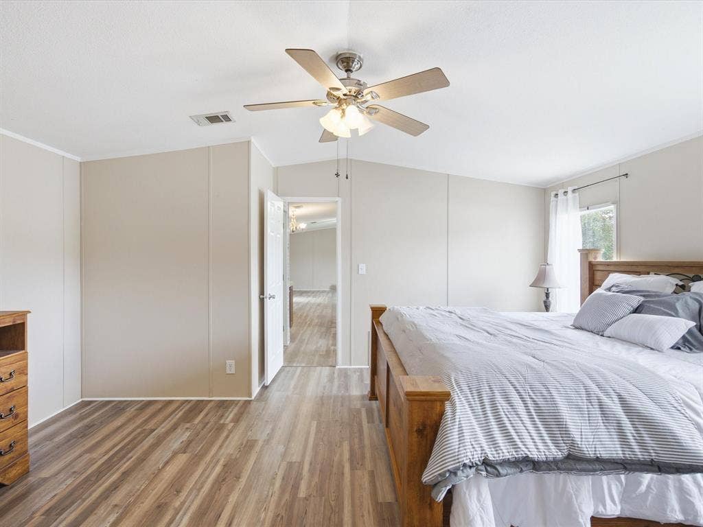 4113 Goliad Drive, Granbury, TX 76048 Oversized ensuite bath with separate vanities, garden tub, shower and two walk in closets.