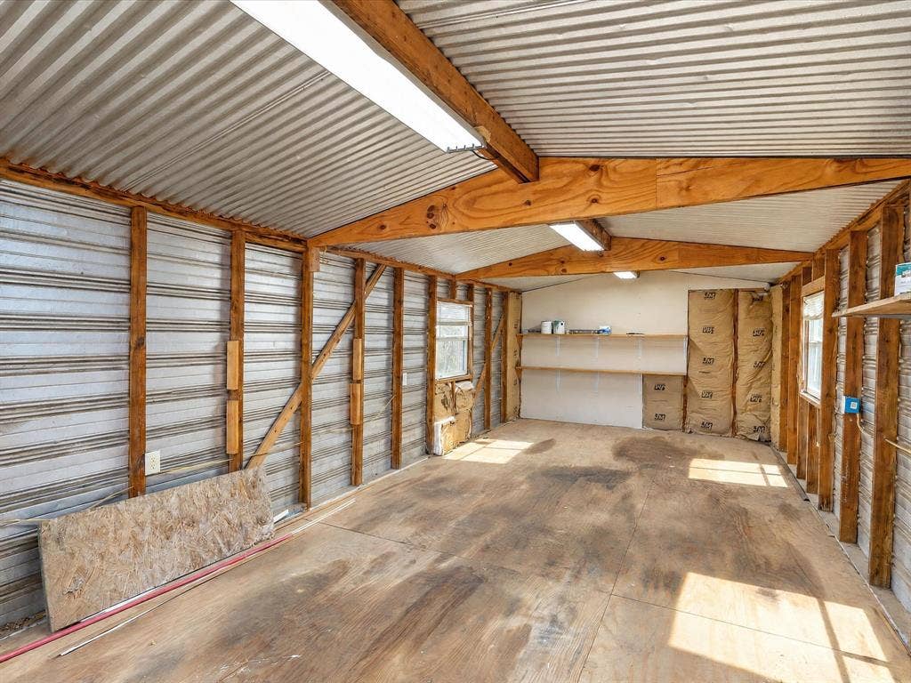 4113 Goliad Drive, Granbury, TX 76048 12x30 shop with electric, double doors, side door and ramp. Fits your tools, atv's, golf cart and mowers.