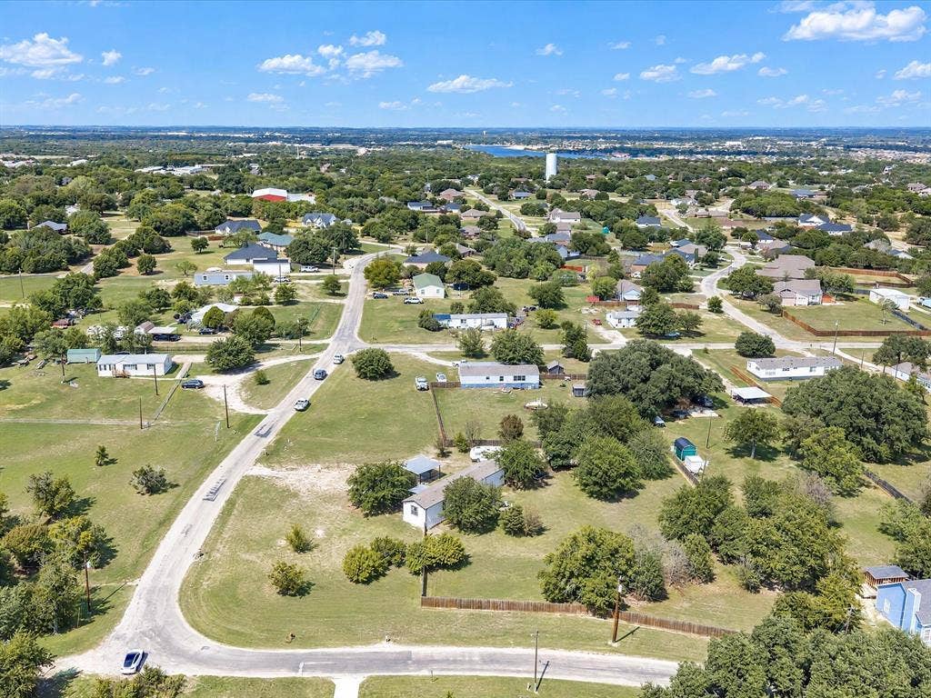 4113 Goliad Drive, Granbury, TX 76048 HUGE corner lot, possibilities are endlless. Short golf cart ride to the lake and marina.
