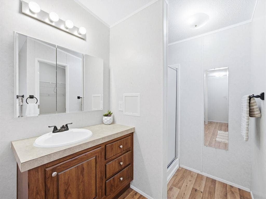4113 Goliad Drive, Granbury, TX 76048 Oversized ensuite bath with separate vanities, garden tub, shower and two walk in closets.
