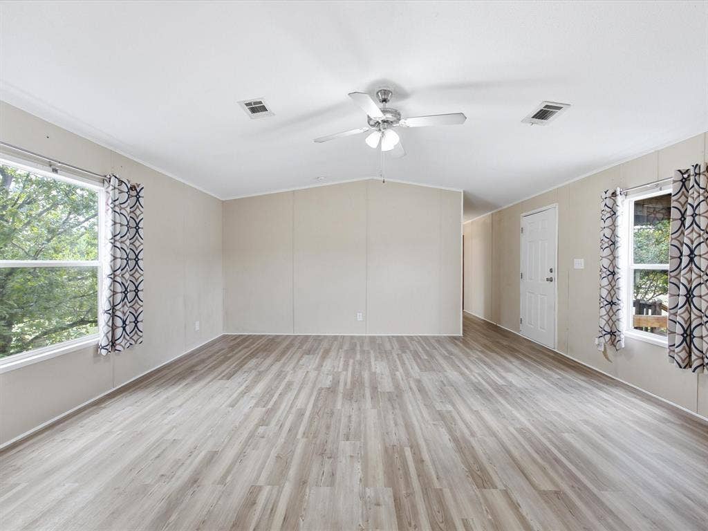 4113 Goliad Drive, Granbury, TX 76048 Spacious open floor plan with vaulted ceilings and ceiling