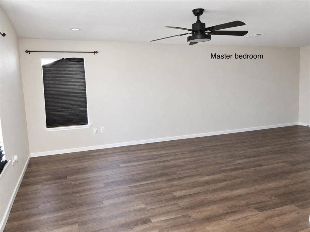 709 SW Dallas Street, Grand Prairie, TX 75051 Room featuring wood-finish flooring, recessed lighting, and a matte black ceiling fan with an integrated light fixture
