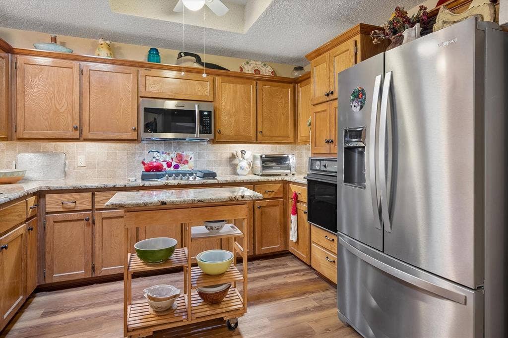 8920 Ashcraft Drive, North Richland Hills, TX 76182 Updated granite countertops and a moveable Island that stays.