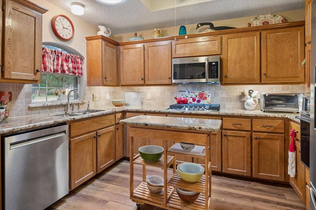 8920 Ashcraft Drive, North Richland Hills, TX 76182 Updated stainless steel appliances and a gas cooktop.